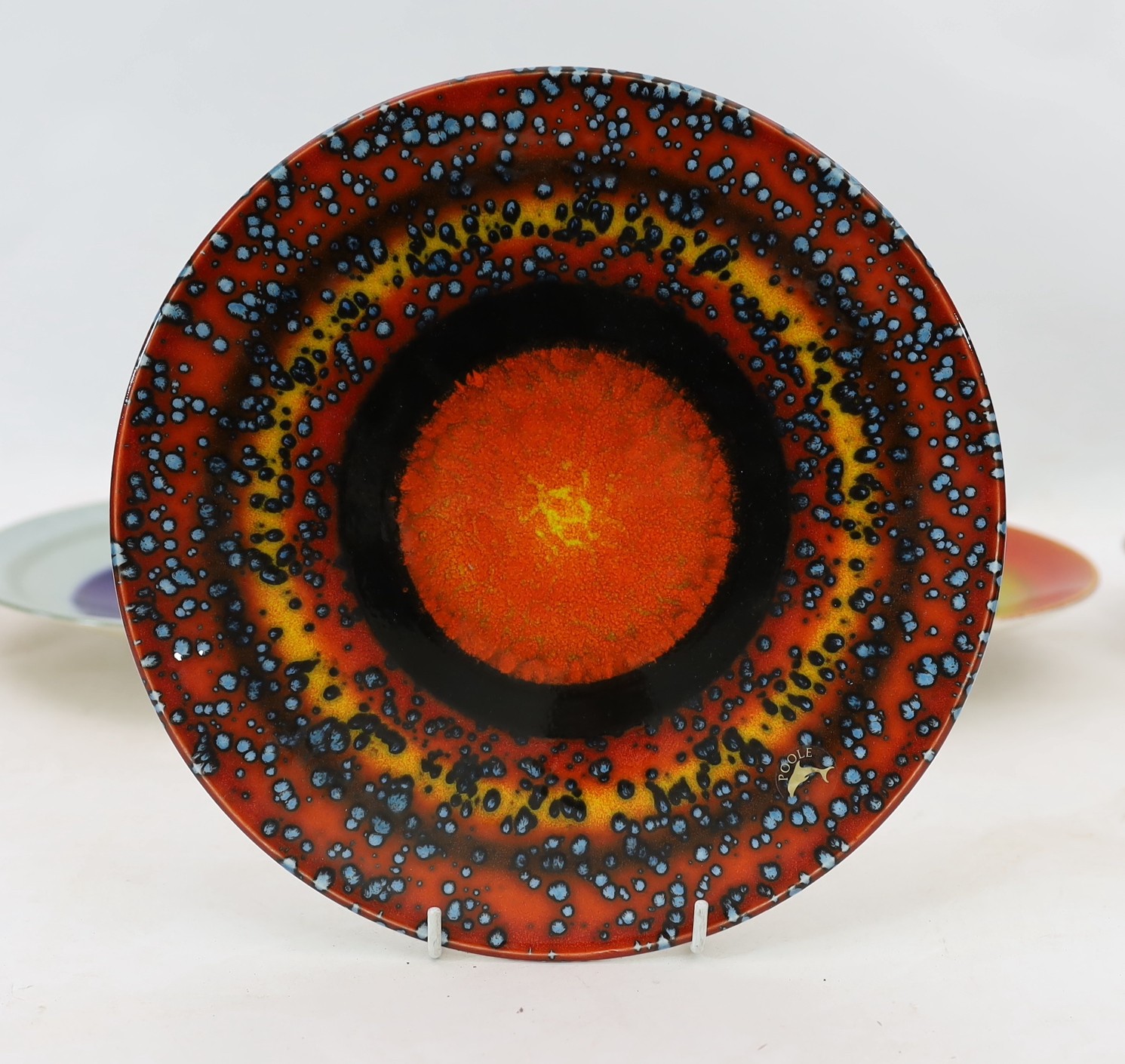 Alan Clarke for Poole Pottery. A set of nine ‘Alignment of the Planets’ chargers and one duplicate, c.2000, 26cm diameter